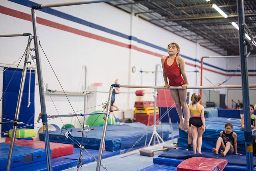 We view competition as an essential part of the gymnastics experience.